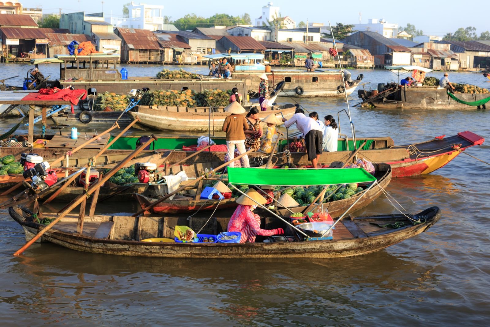 Boats and vendors at Cai Rang floating market in Can Tho
