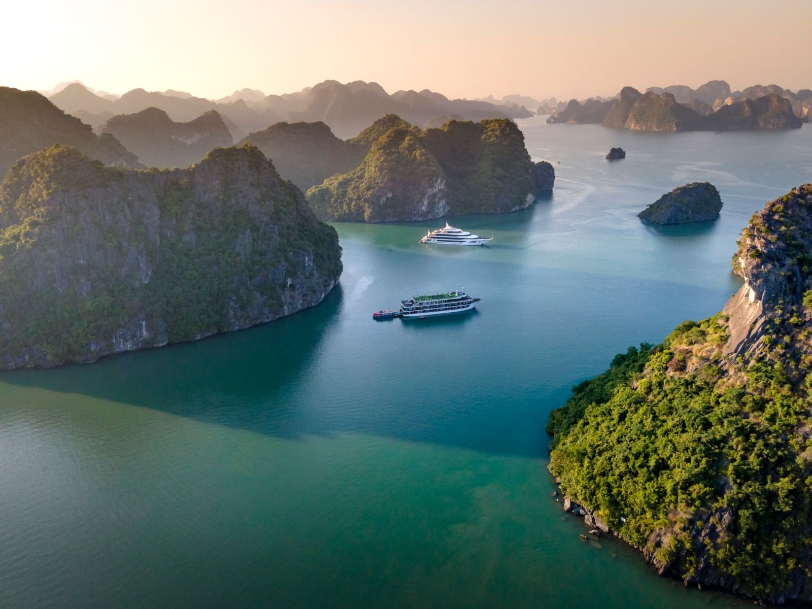Cruise boats among limestone islands in Halong Bay, Vietnam