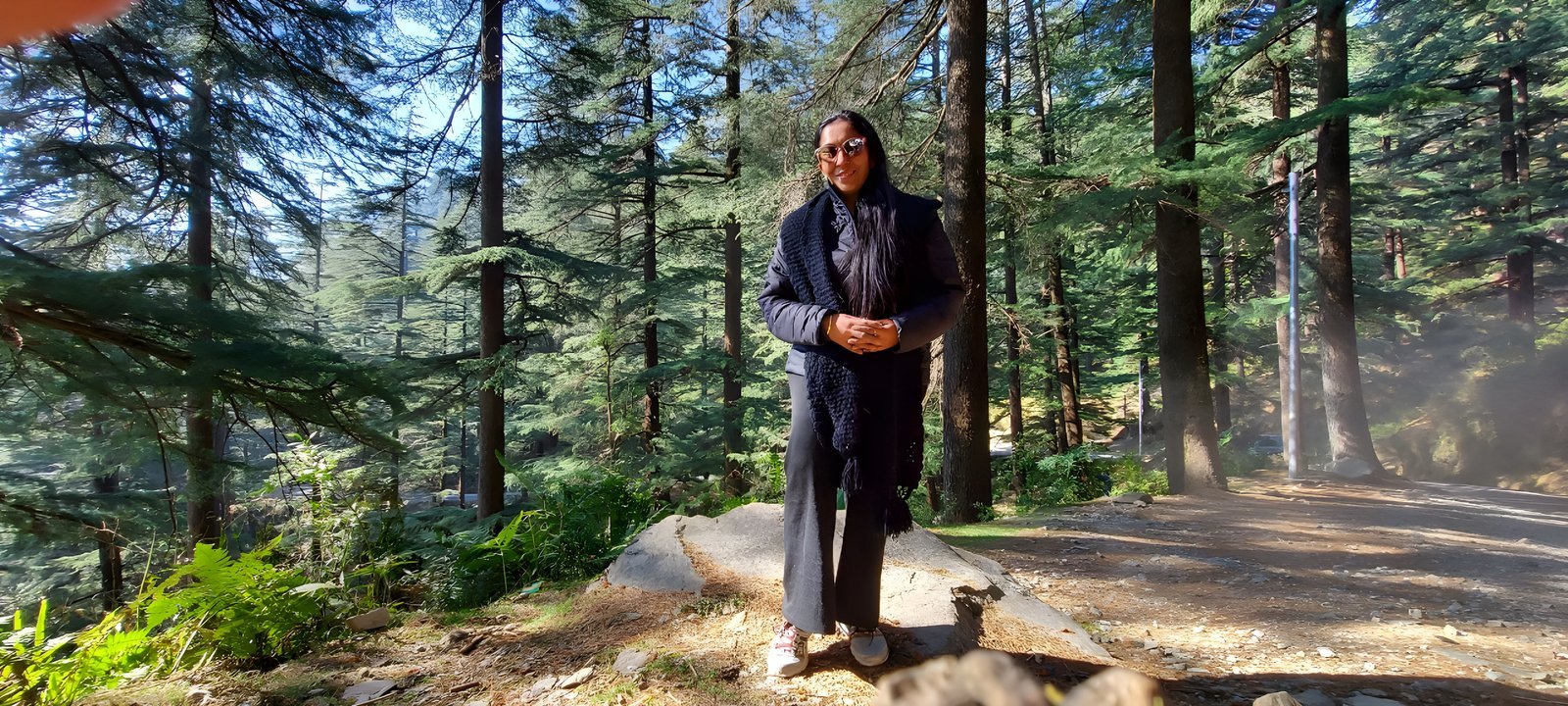 Mandeep Sikder standing among forest trees
